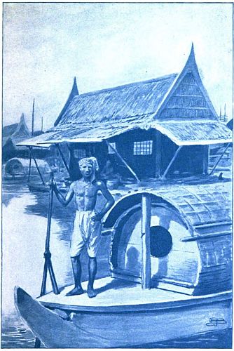 man on deck of houseboat, house in background