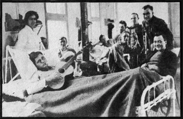 Ward in an A.E.F. Hospital, Showing Some of the First to
Pay a Visit to "Blighty."